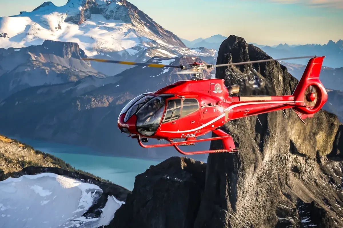 red blackcomb helicopter over canada