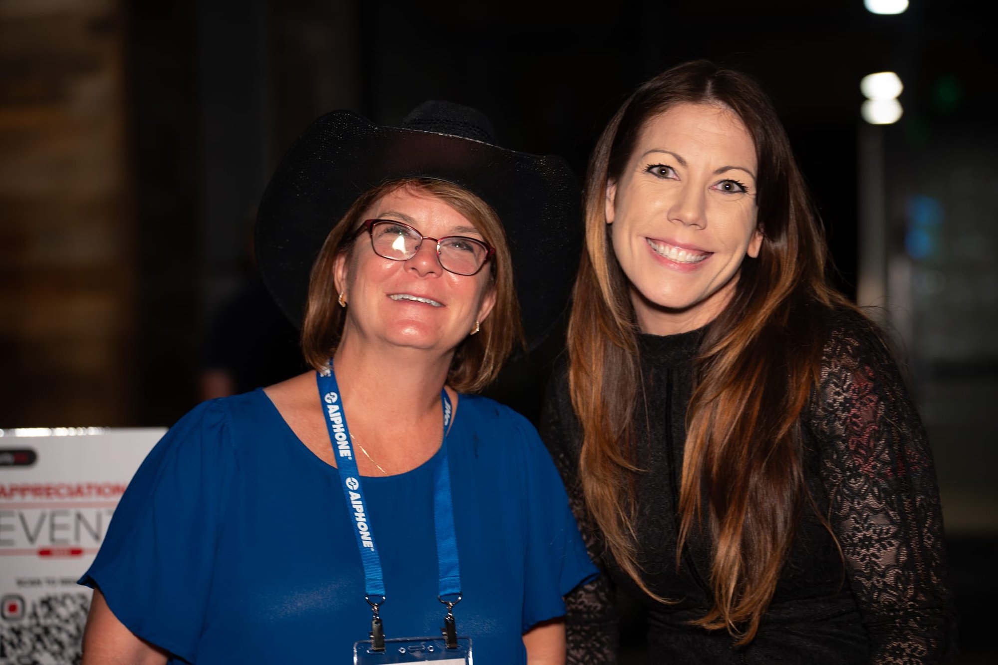 Candid shot of Stephanie Offutt and another attendee of Security 101 Appreciation Event at Happiest Hour in Dallas, TX