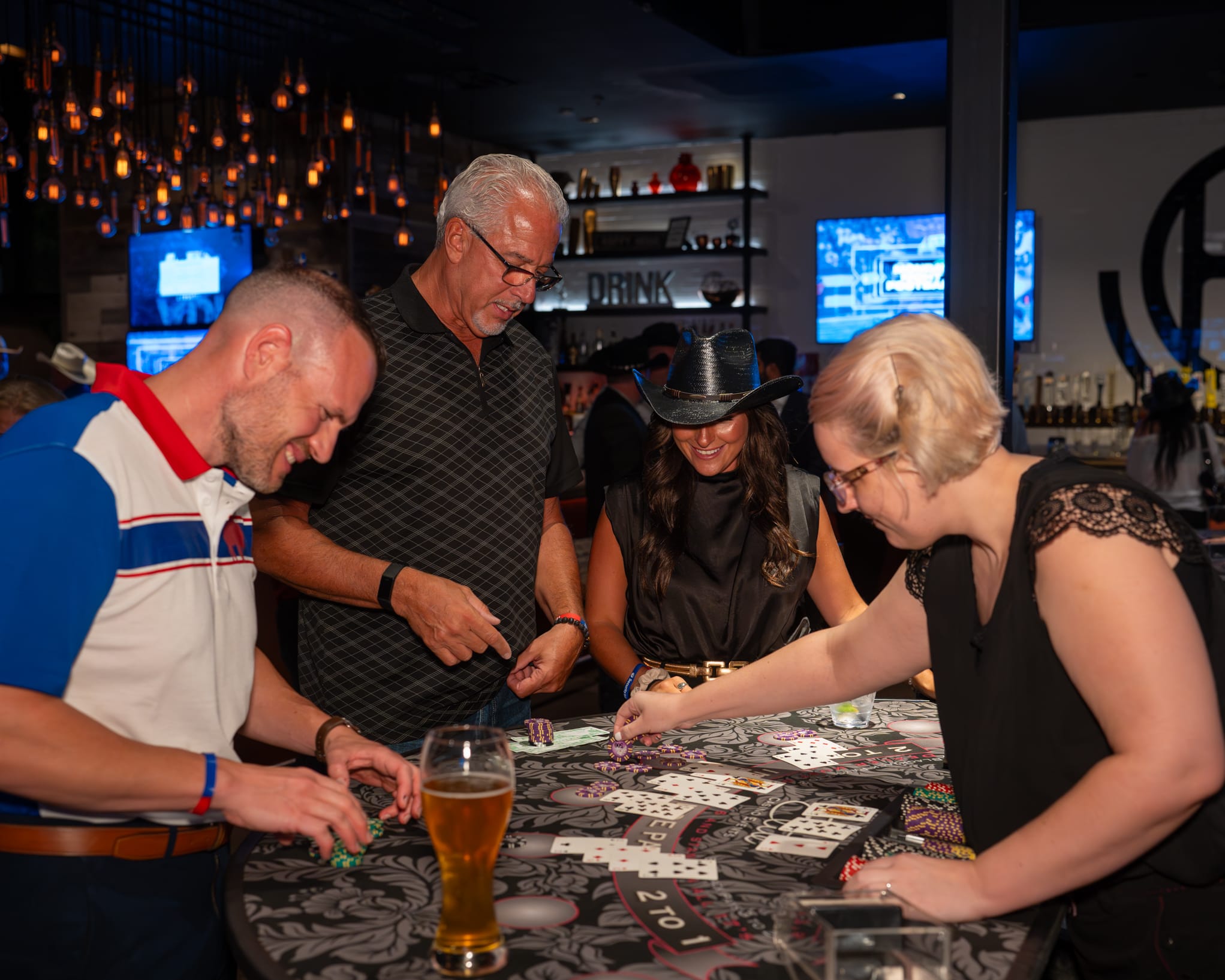 Attendees of Security 101 Appreciation Event participate in casino games at Happiest Hour in Dallas, TX