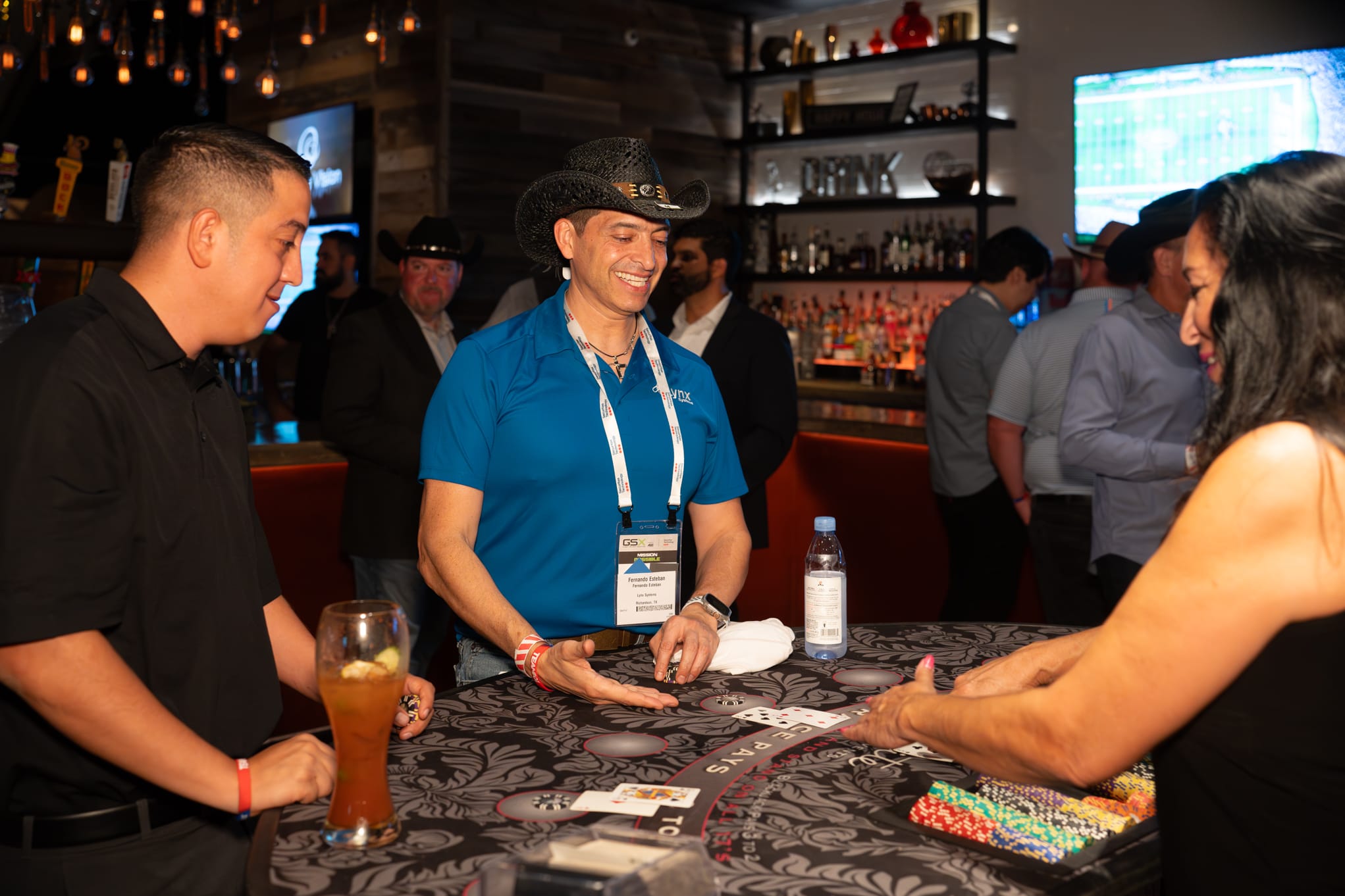 Attendees of Security 101 Appreciation Event participate in casino games at Happiest Hour in Dallas, TX