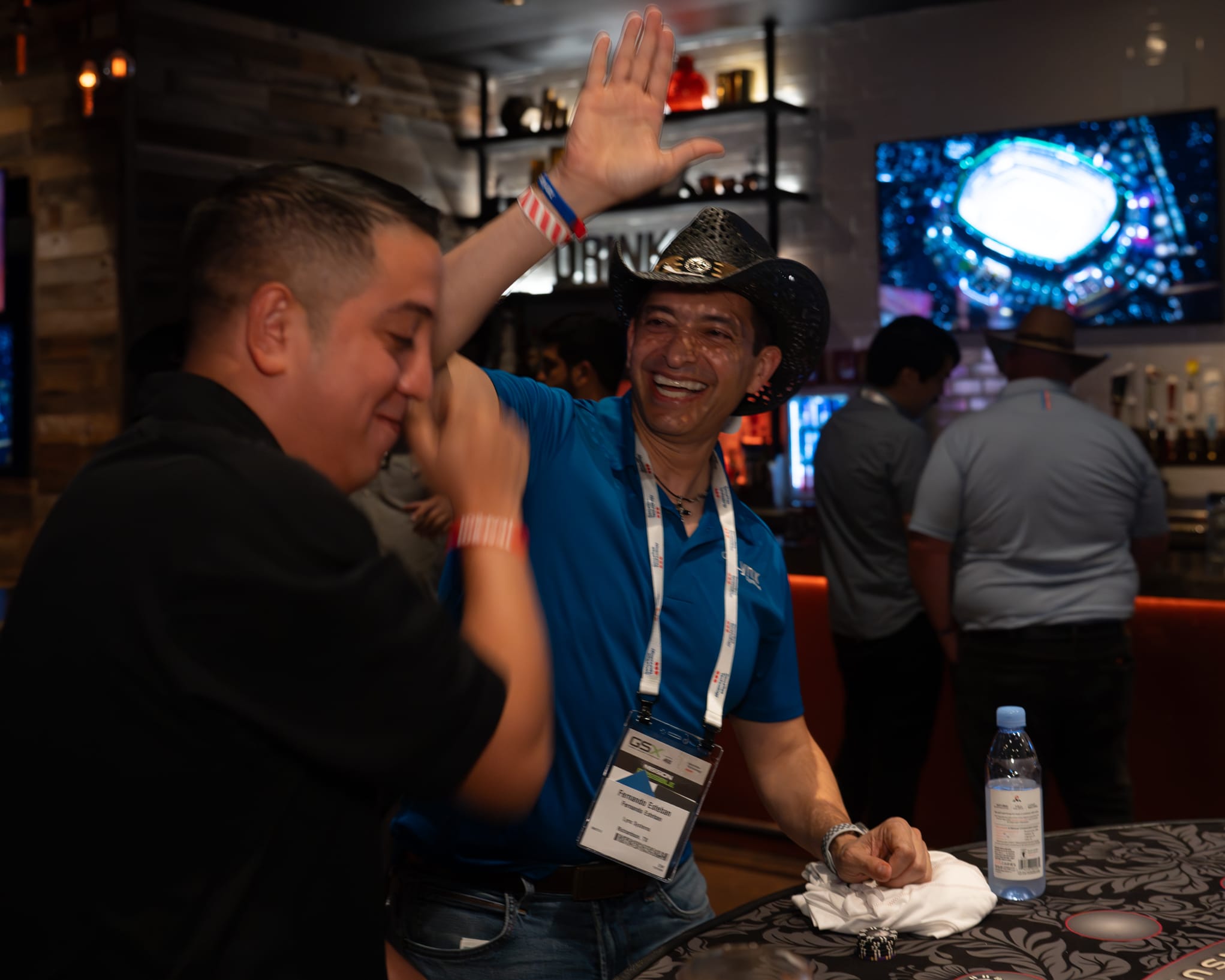 Attendees of Security 101 Appreciation Event participate in casino games at Happiest Hour in Dallas, TX