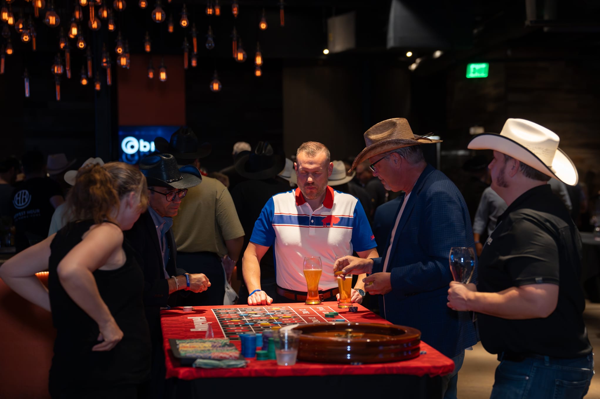 Attendees of Security 101 Appreciation Event participate in casino games at Happiest Hour in Dallas, TX