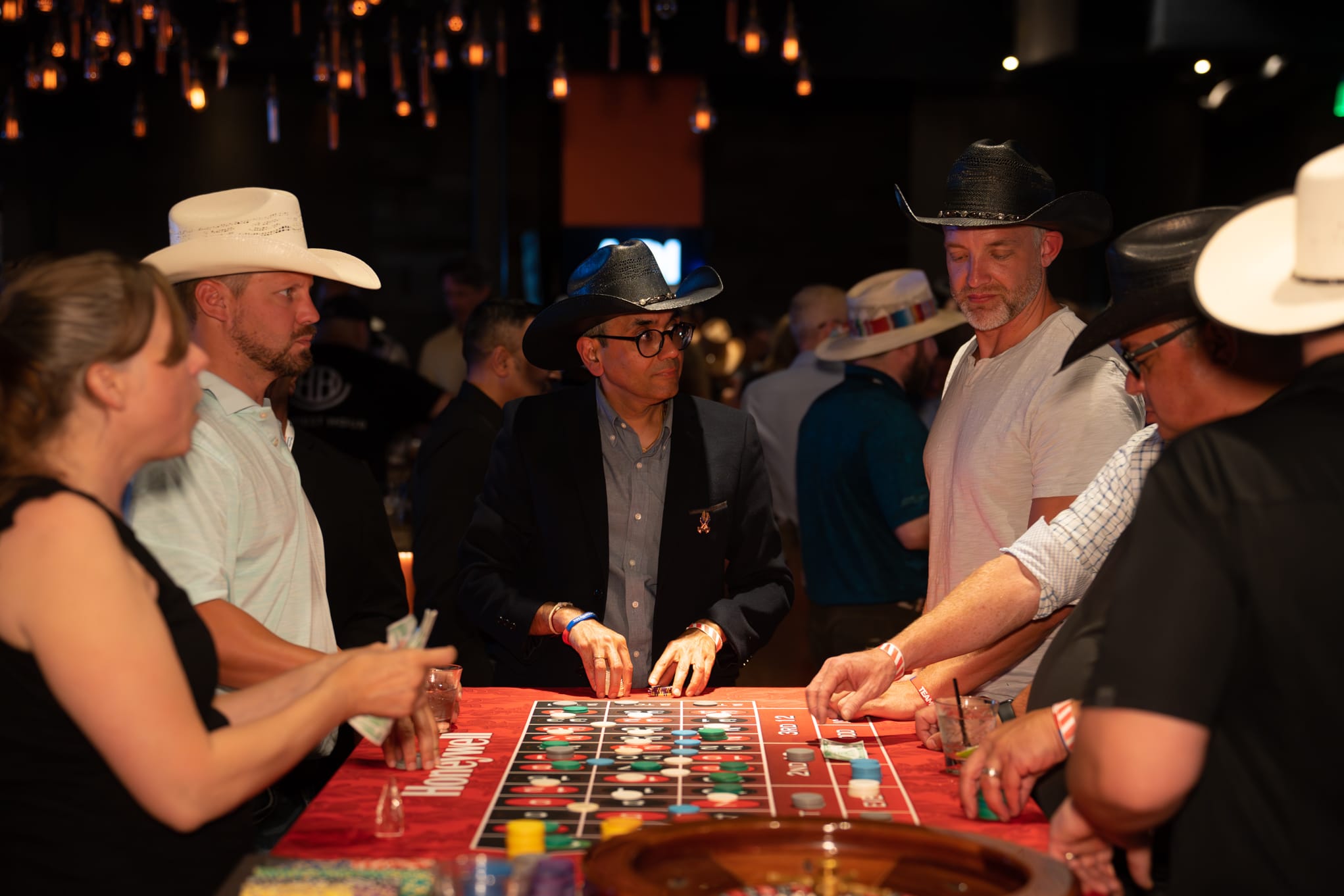 Attendees of Security 101 Appreciation Event participate in casino games at Happiest Hour in Dallas, TX