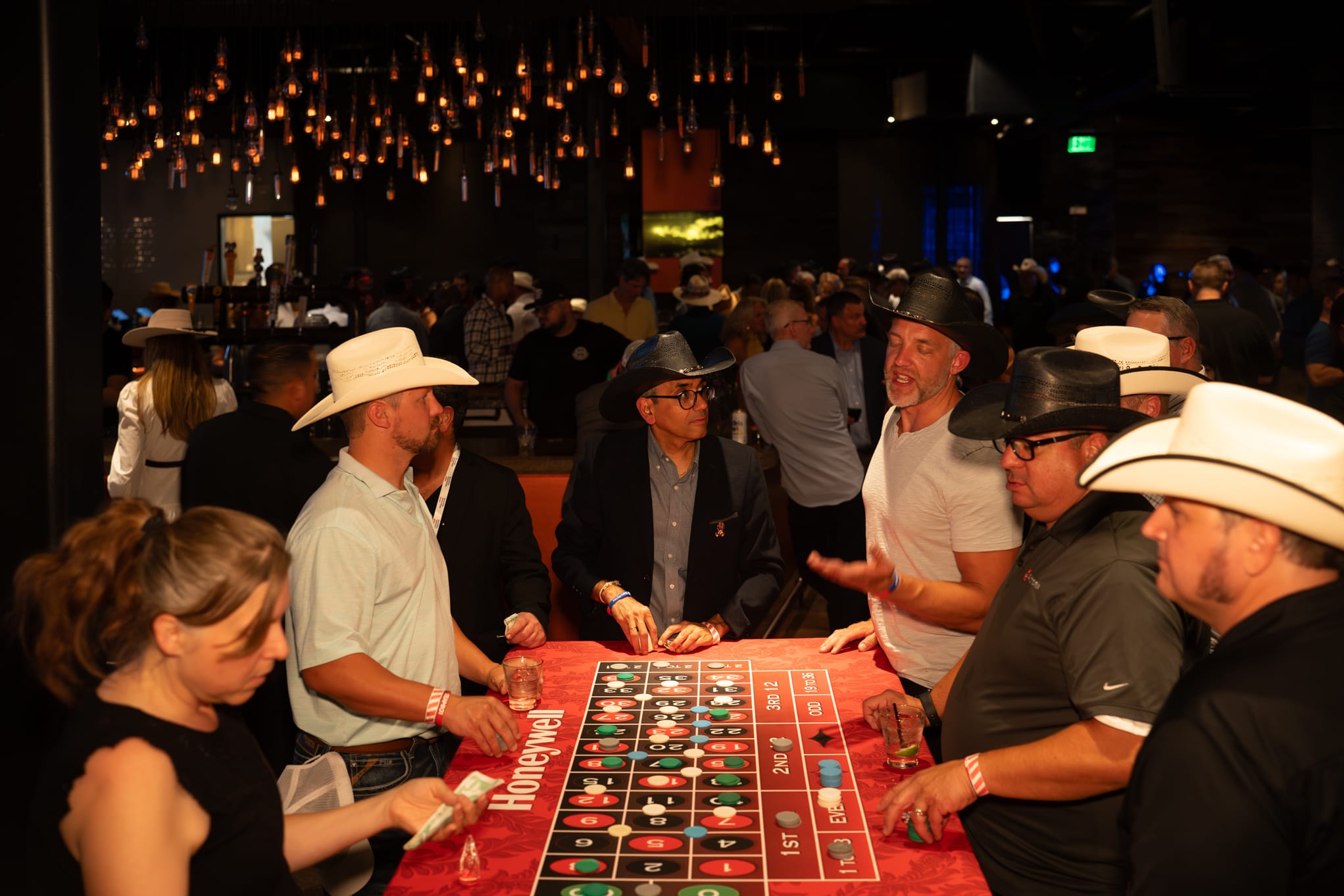 Attendees of Security 101 Appreciation Event participate in casino games at Happiest Hour in Dallas, TX