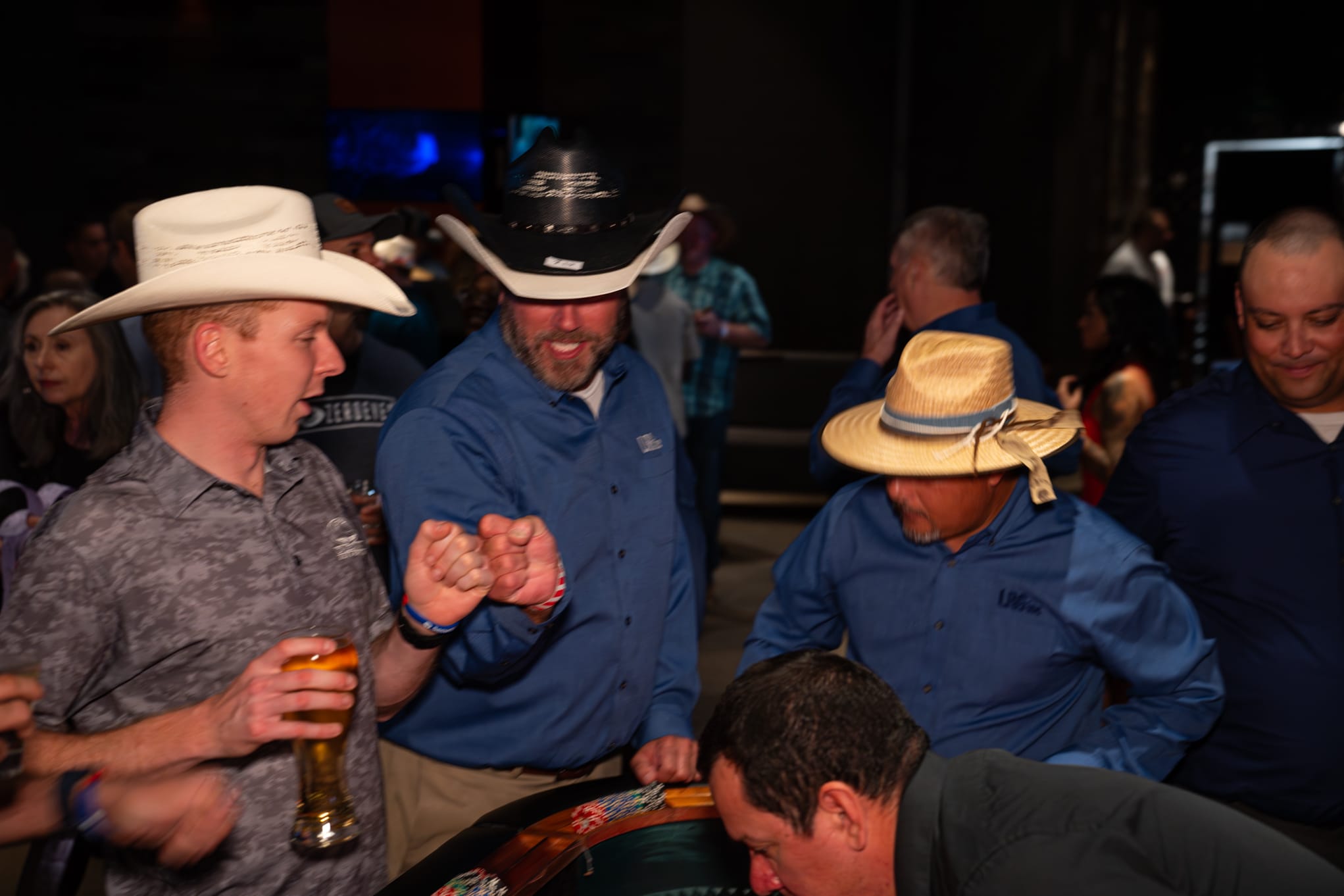 Attendees of Security 101 Appreciation Event participate in casino games at Happiest Hour in Dallas, TX