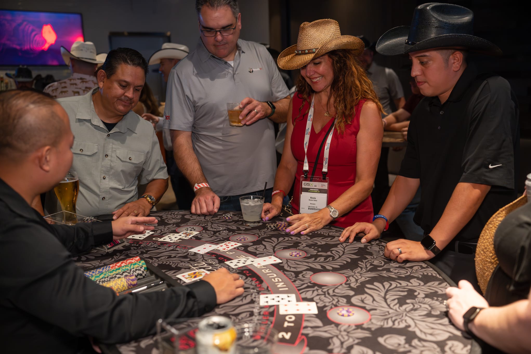 Attendees of Security 101 Appreciation Event participate in casino games at Happiest Hour in Dallas, TX