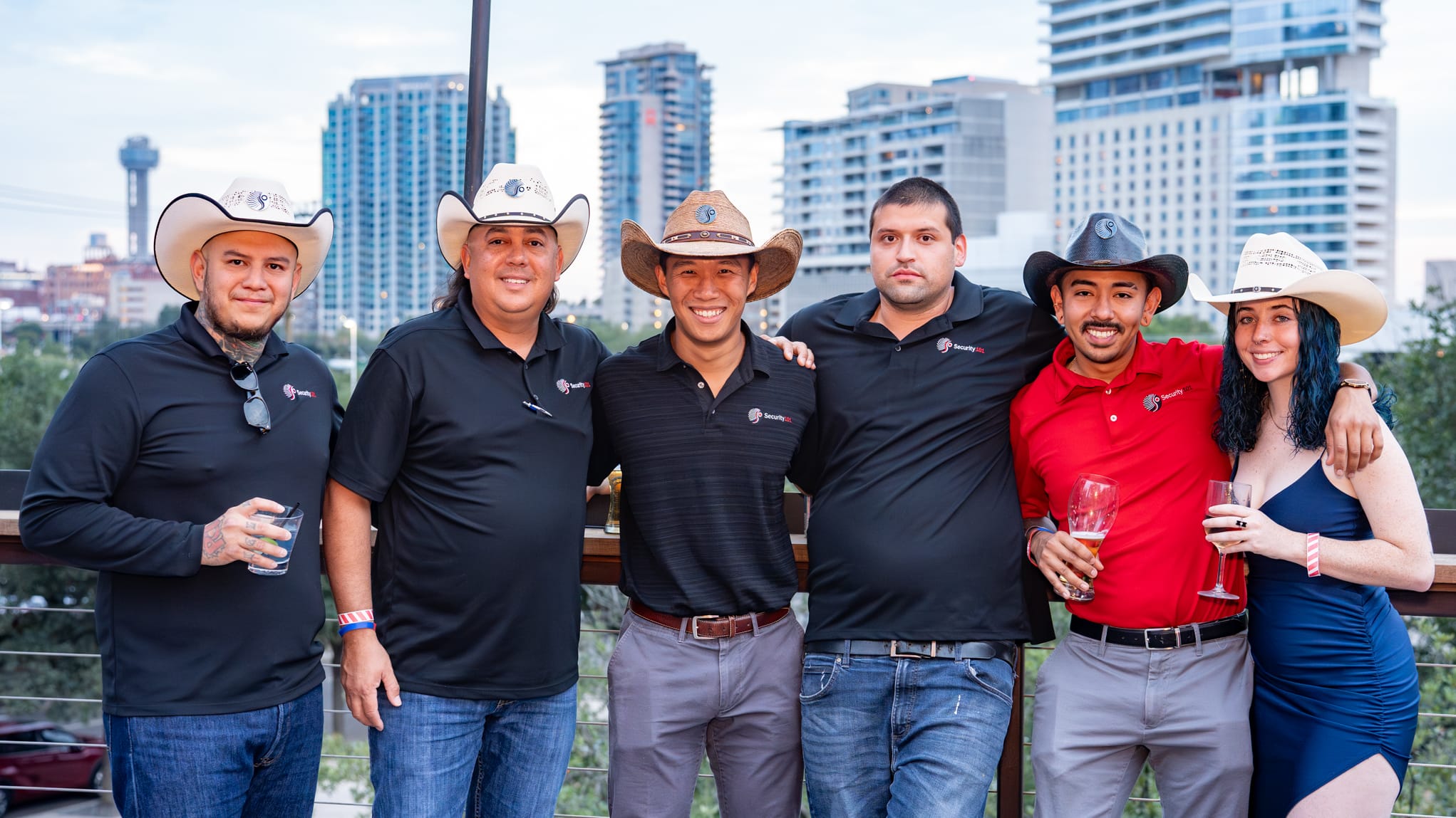 Security 101 Appreciation Event attendees network on the rooftop patio of Happiest Hour in Dallas, TX