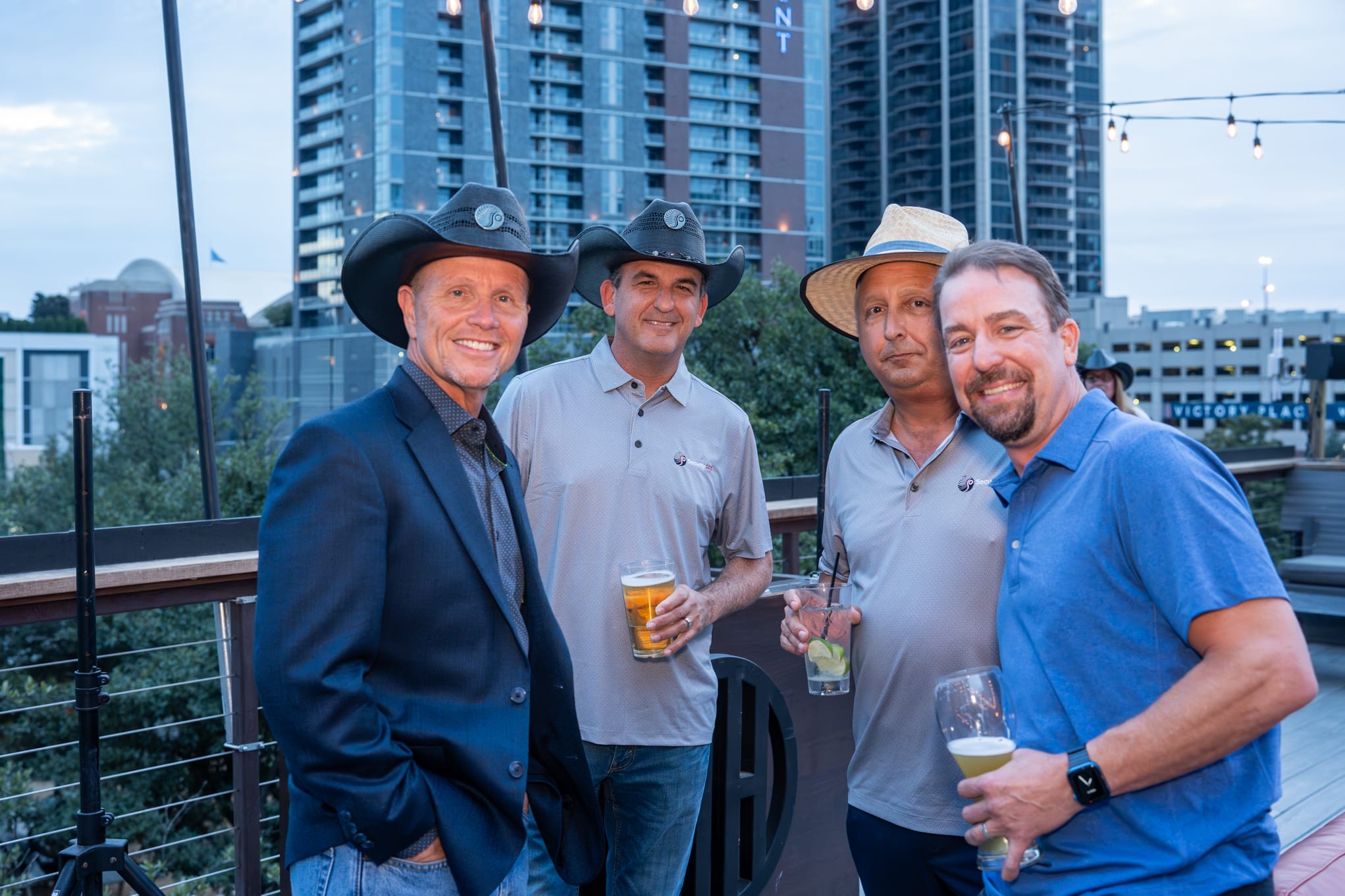 Security 101 Appreciation Event attendees network on the rooftop patio of Happiest Hour in Dallas, TX