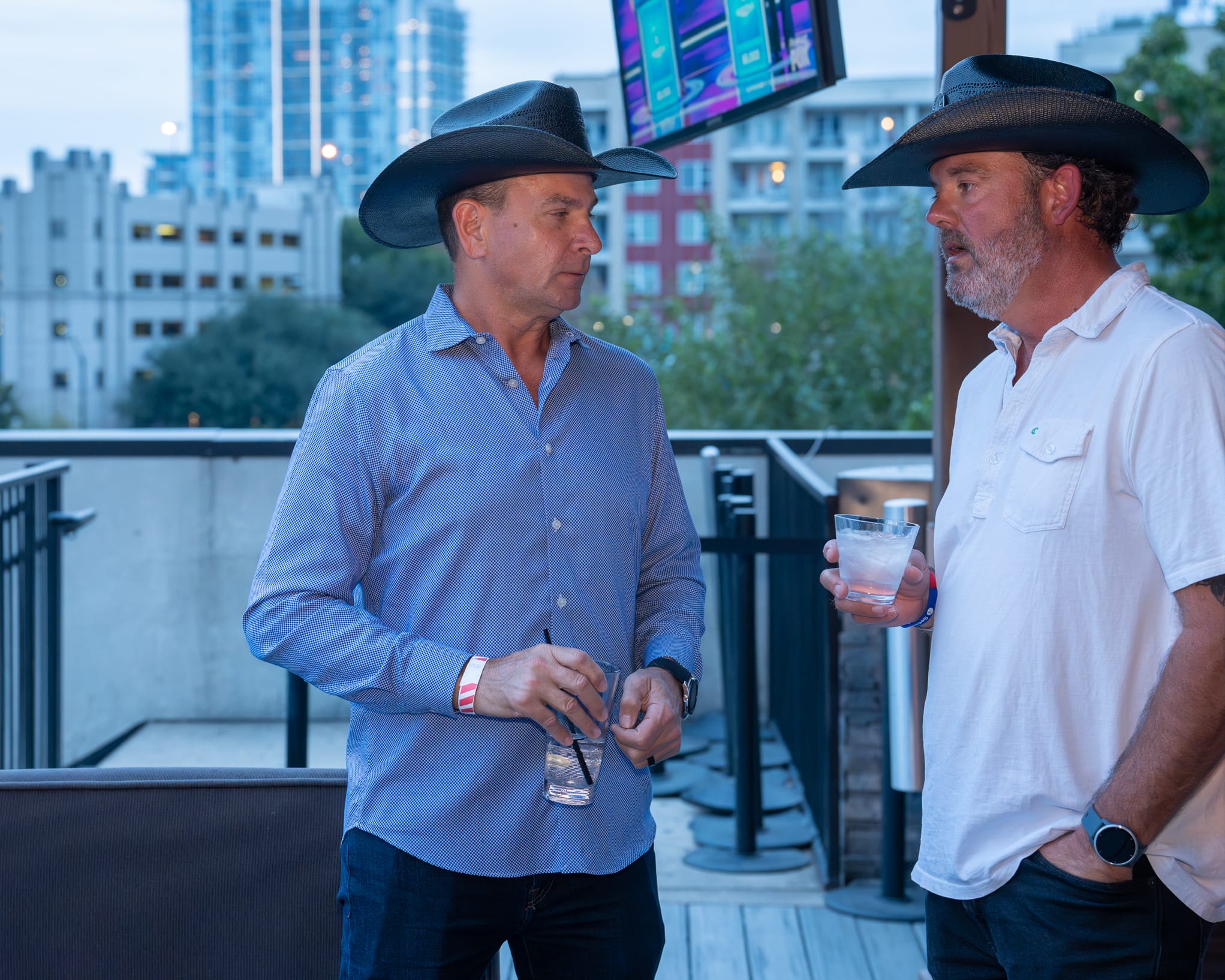 Security 101 Appreciation Event attendees network on the rooftop patio of Happiest Hour in Dallas, TX