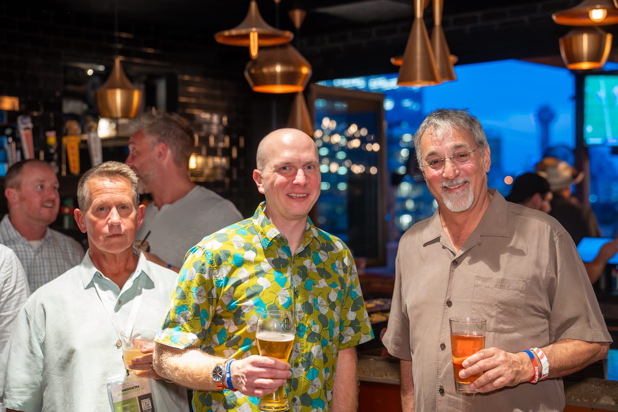 Security 101 Appreciation Event attendees network on the rooftop patio of Happiest Hour in Dallas, TX