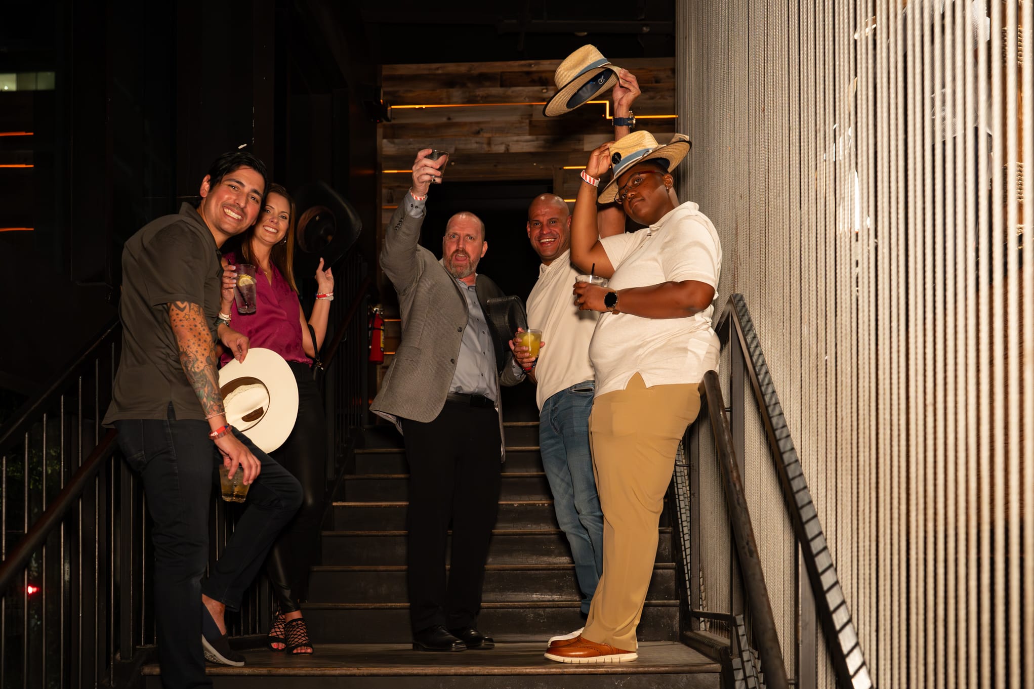 Security 101 Appreciation Event attendees head up to the rooftop patio of Happiest Hour in Dallas, TX