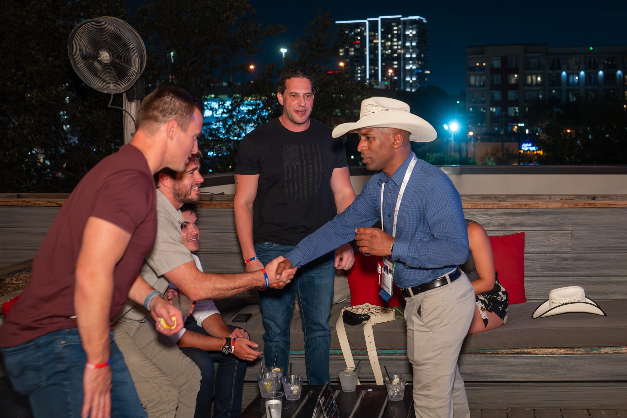 Security 101 Appreciation Event attendees network on the rooftop patio of Happiest Hour in Dallas, TX