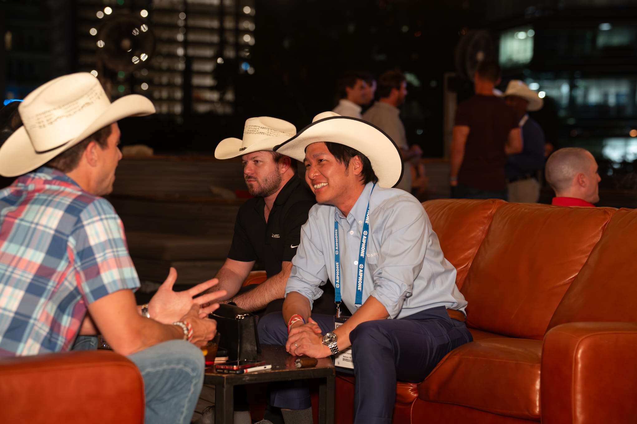 Security 101 Appreciation Event attendees network on the rooftop patio of Happiest Hour in Dallas, TX