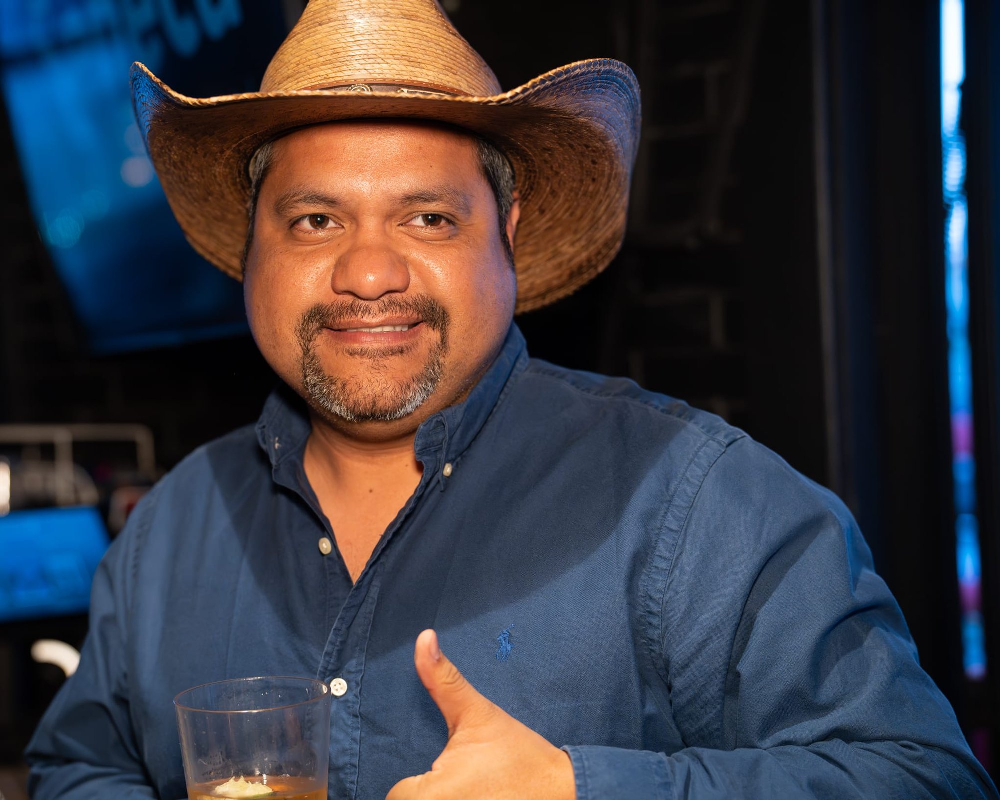 Wild Bill makes custom cowboy hats for Security 101’s Appreciation Event attendees at the Happiest Hour rooftop bar