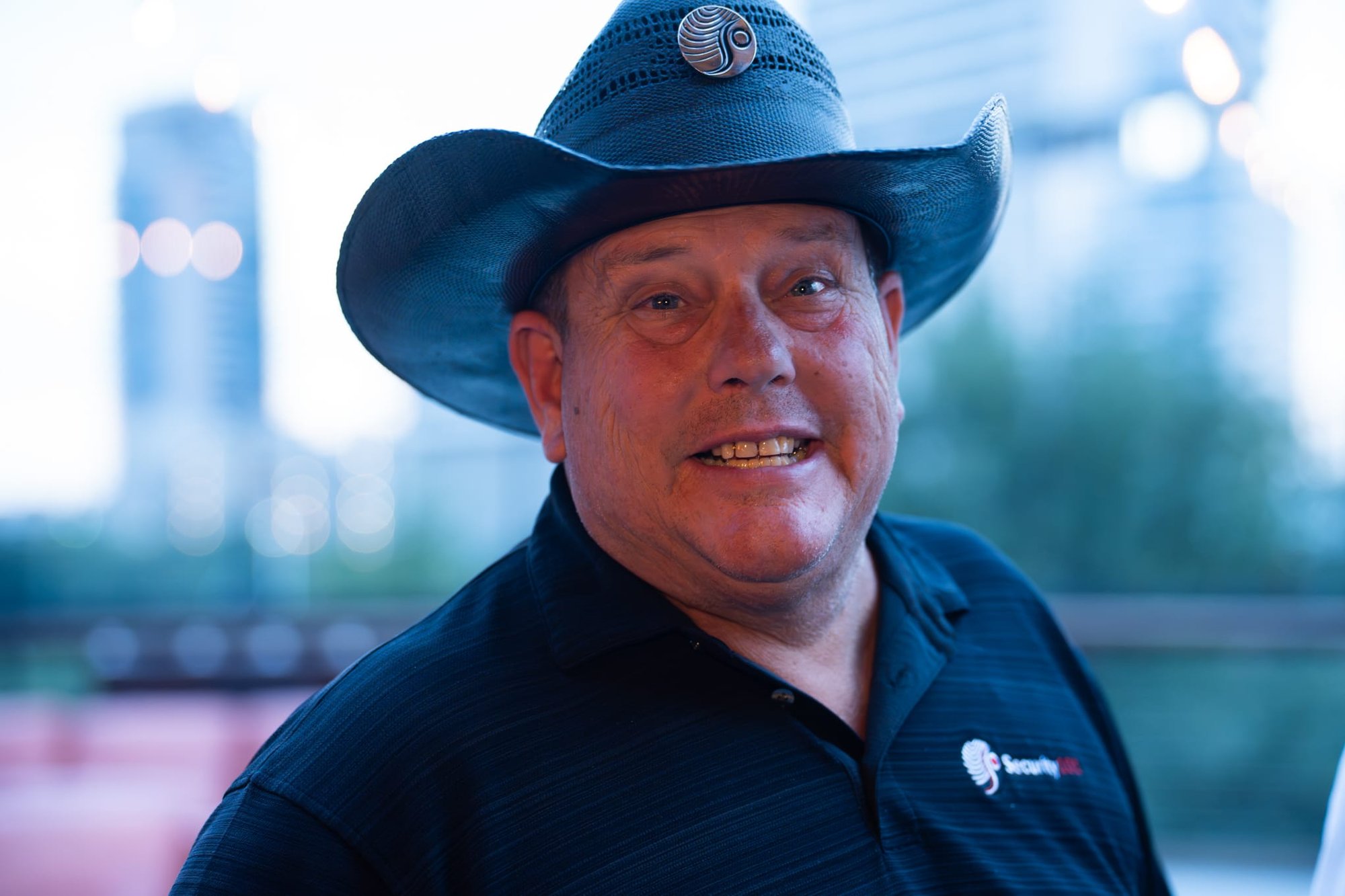 Wild Bill makes custom cowboy hats for Security 101’s Appreciation Event attendees at the Happiest Hour rooftop bar