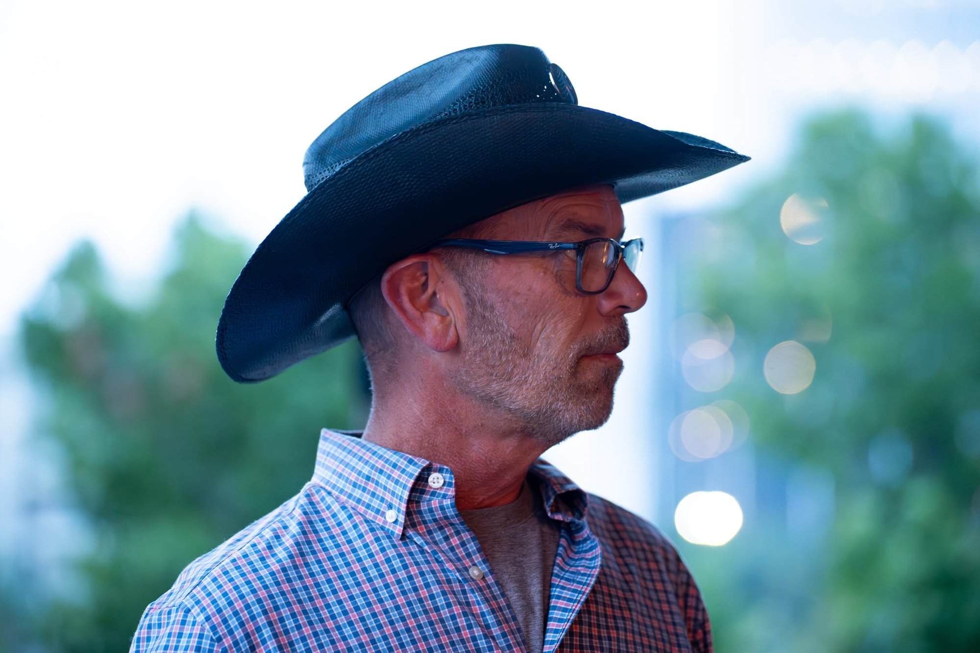 Wild Bill makes custom cowboy hats for Security 101’s Appreciation Event attendees at the Happiest Hour rooftop bar