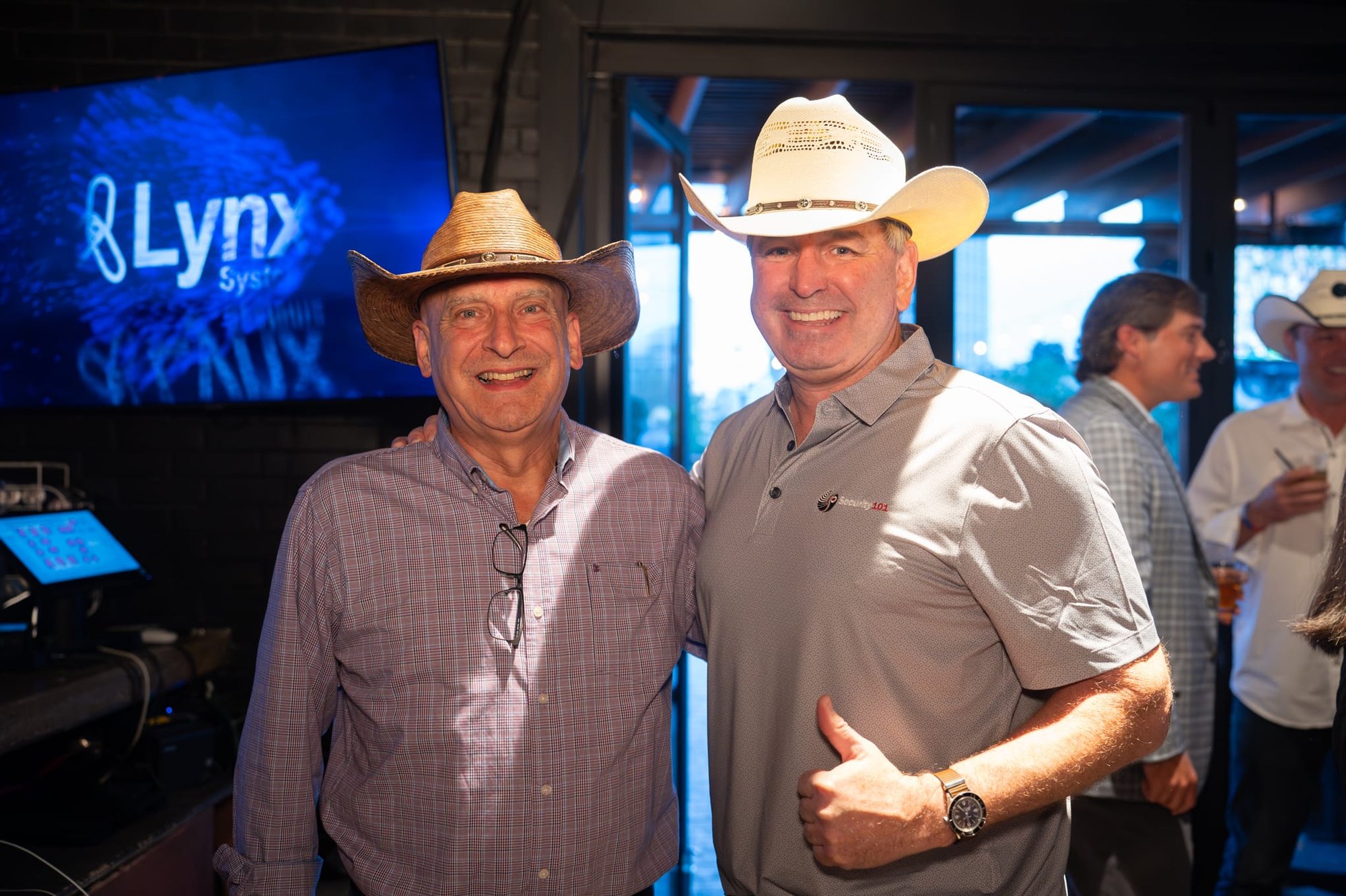 Wild Bill makes custom cowboy hats for Security 101’s Appreciation Event attendees at the Happiest Hour rooftop bar