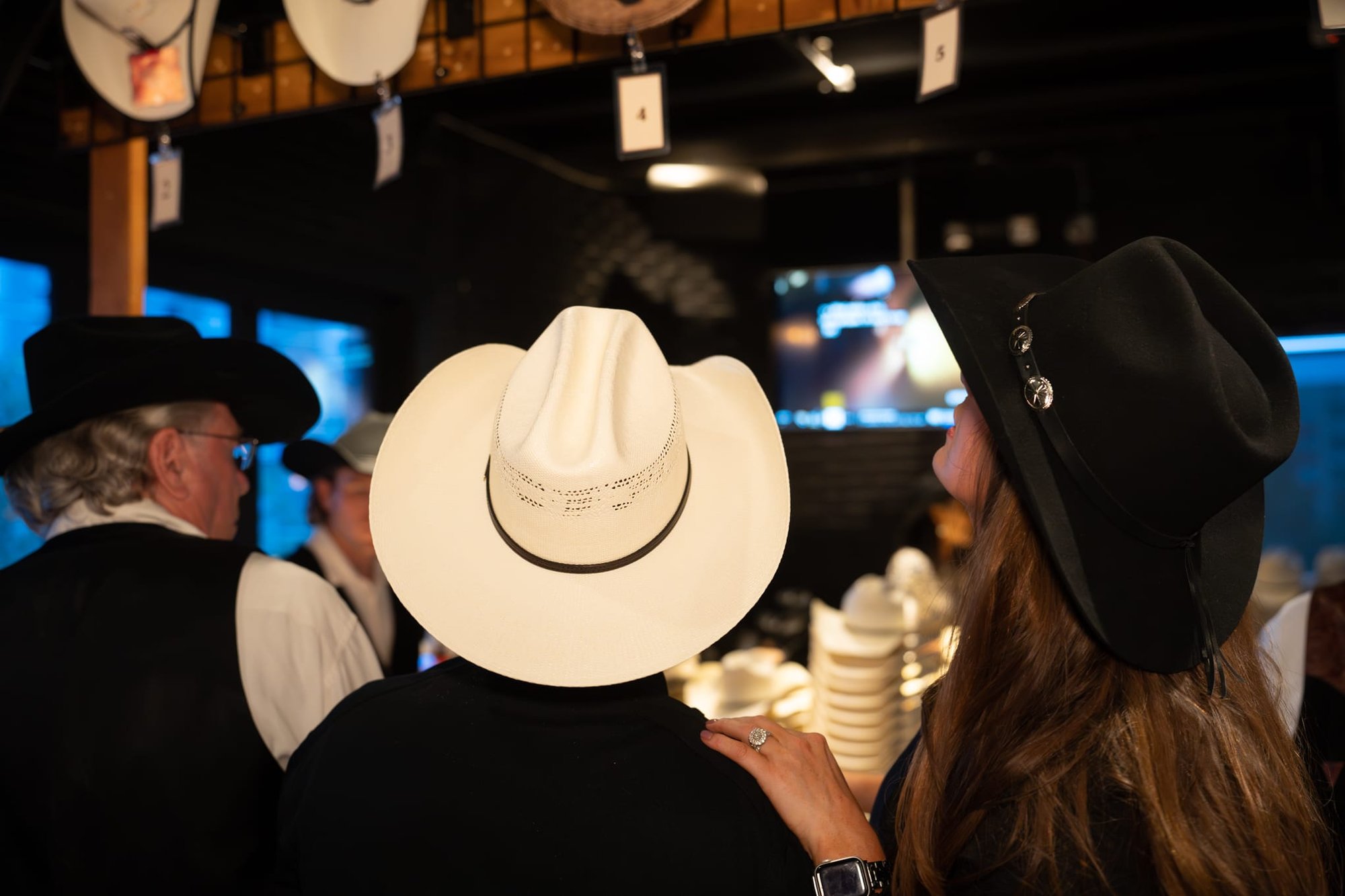 Wild Bill makes custom cowboy hats for Security 101’s Appreciation Event attendees at the Happiest Hour rooftop bar