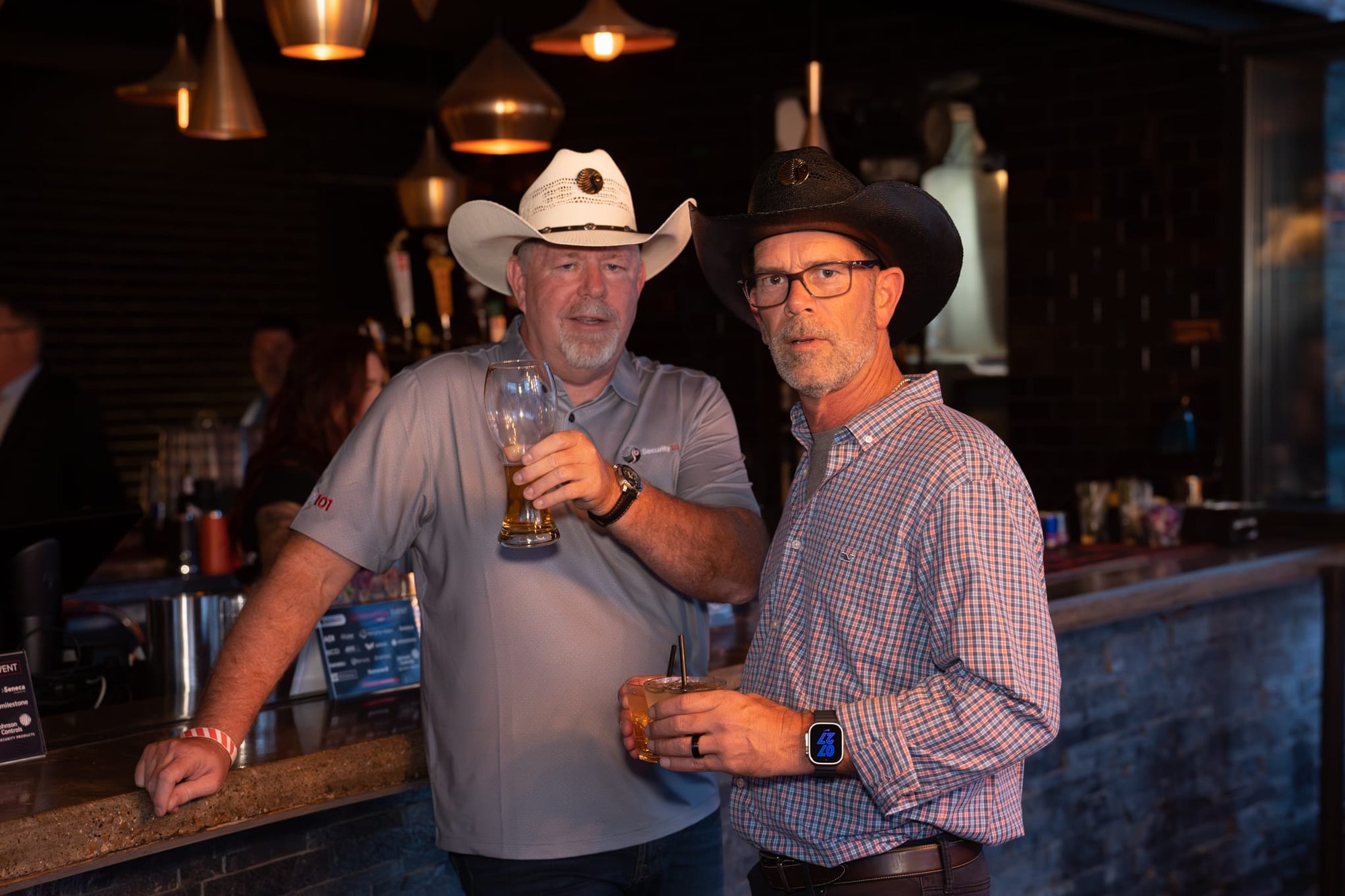 Wild Bill makes custom cowboy hats for Security 101’s Appreciation Event attendees at the Happiest Hour rooftop bar