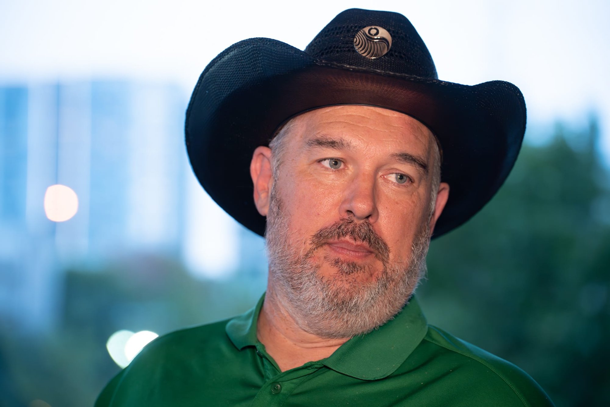 Wild Bill makes custom cowboy hats for Security 101’s Appreciation Event attendees at the Happiest Hour rooftop bar