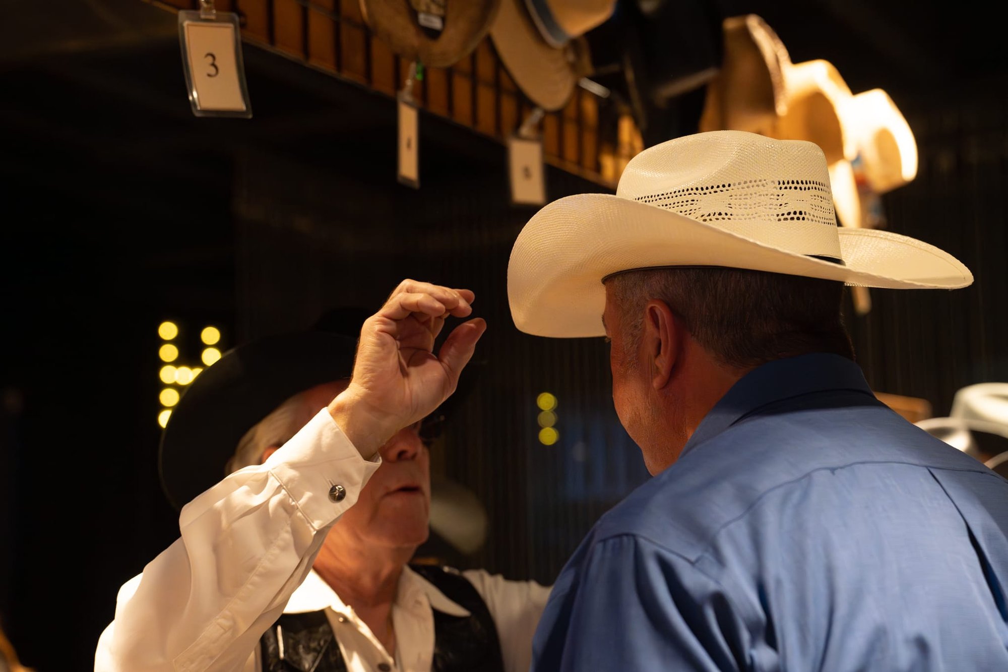 Wild Bill makes custom cowboy hats for Security 101’s Appreciation Event attendees at the Happiest Hour rooftop bar