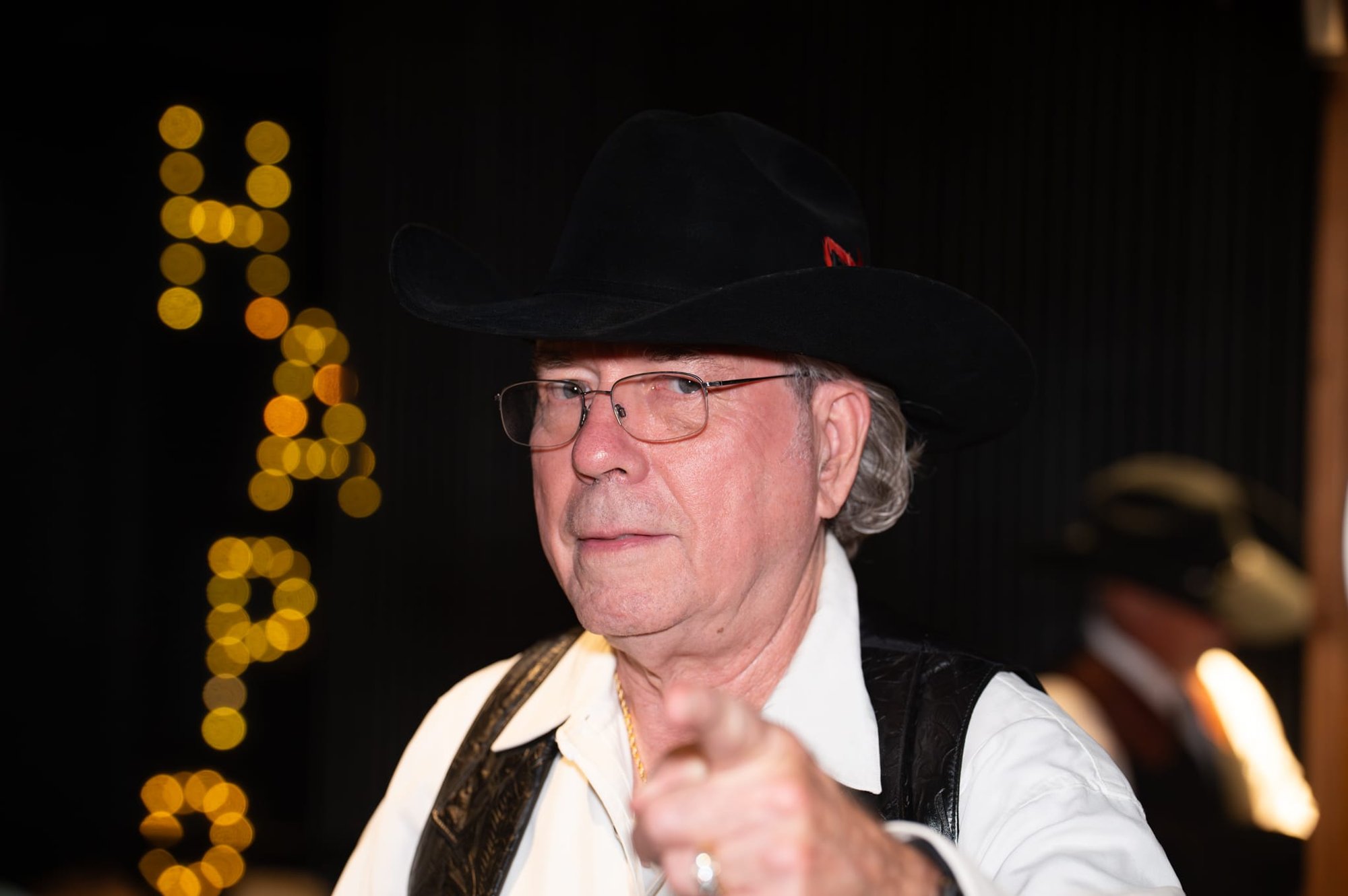 Wild Bill makes custom cowboy hats for Security 101’s Appreciation Event attendees at the Happiest Hour rooftop bar