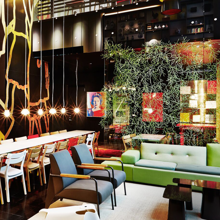 the lobby of citizenM, an affordable luxury hotel brand with a mission to promote environmental responsibility